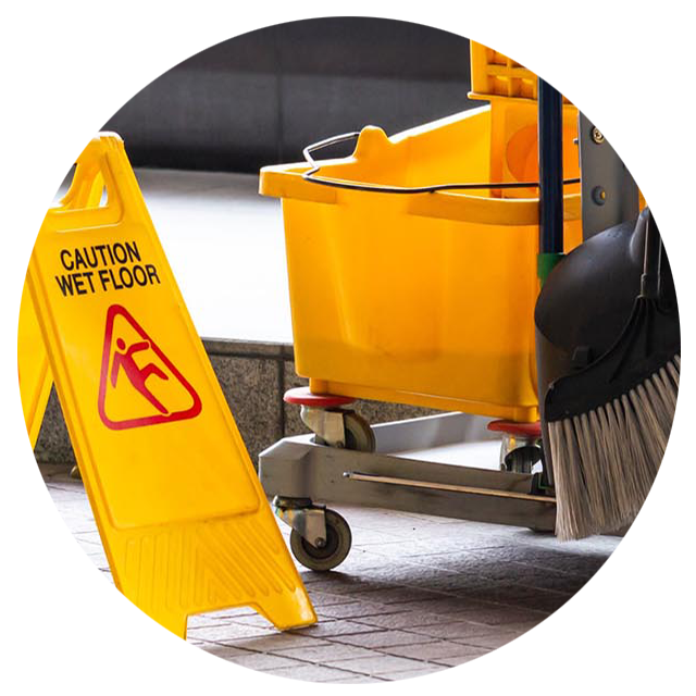 Yellow wet floor caution sign next to a yellow bucket